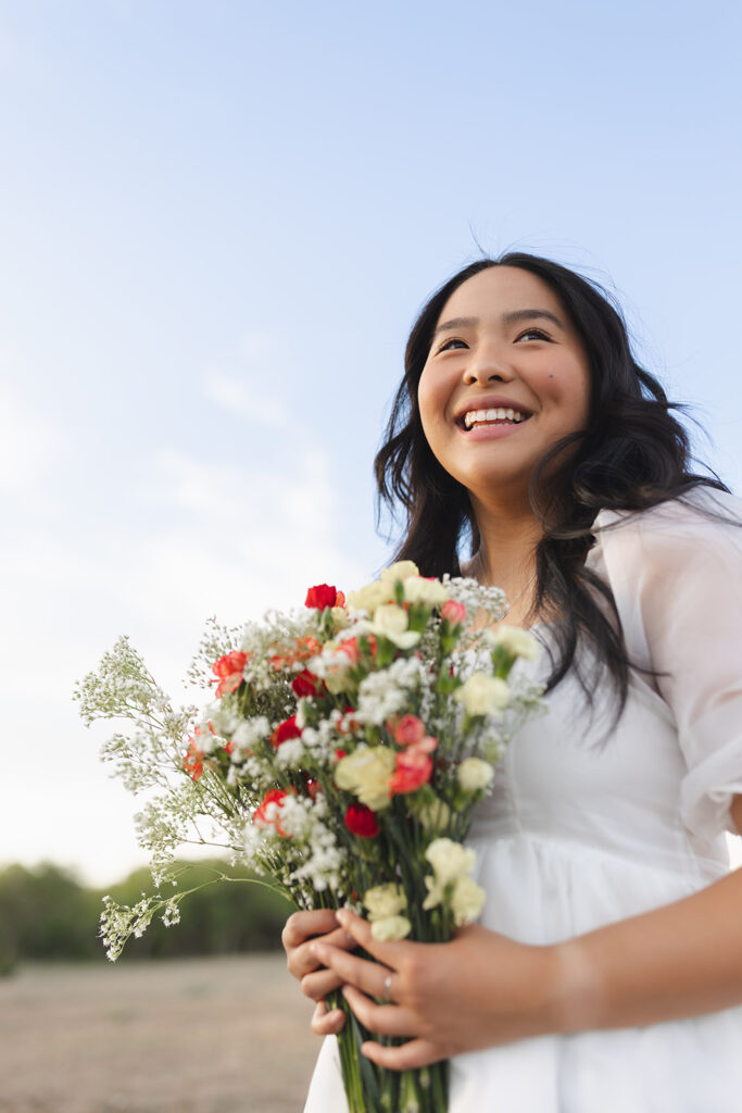 Unique A&M Senior Session with a bouquet of flowers