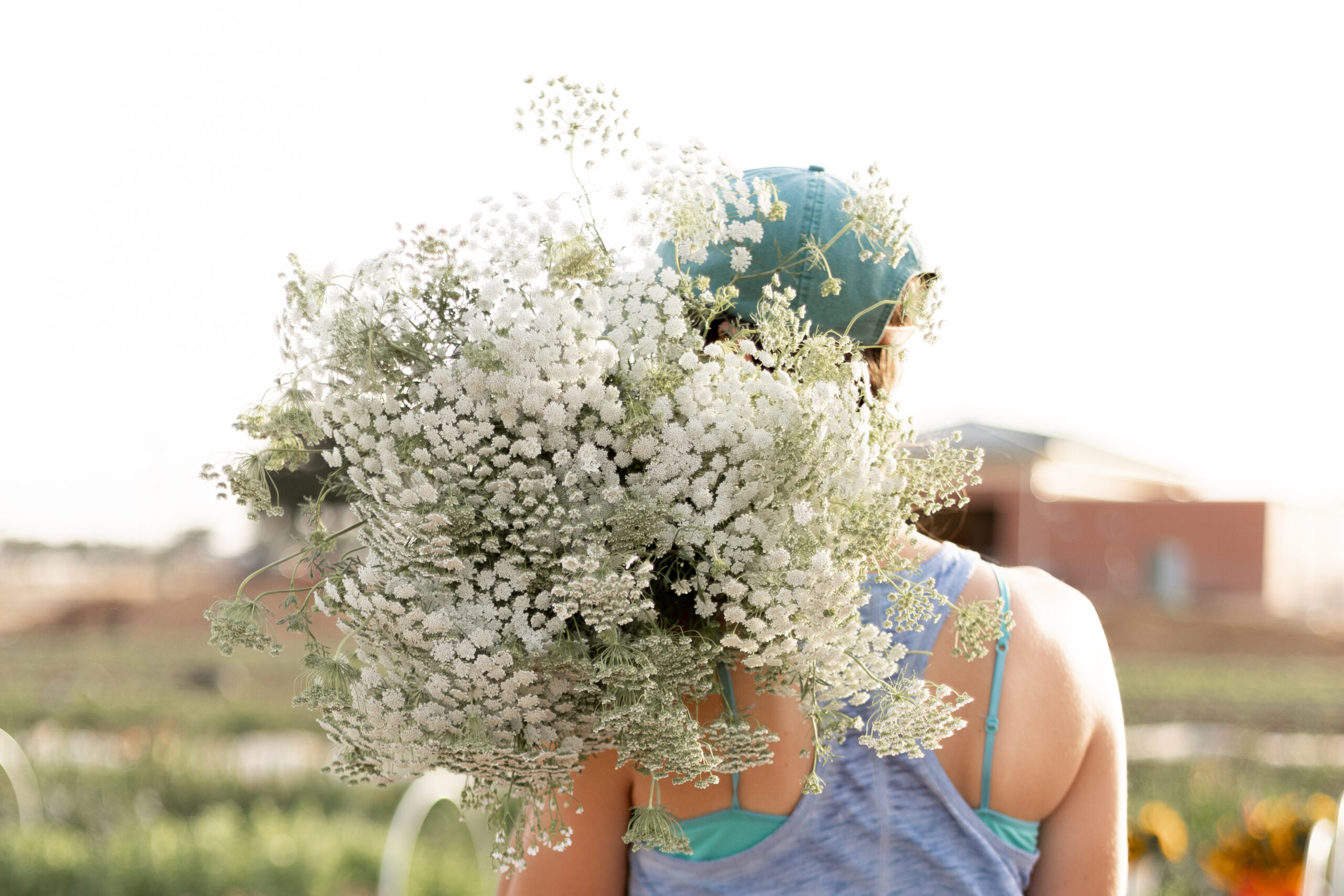 College station flower farmer holding a large bouquet of flowers