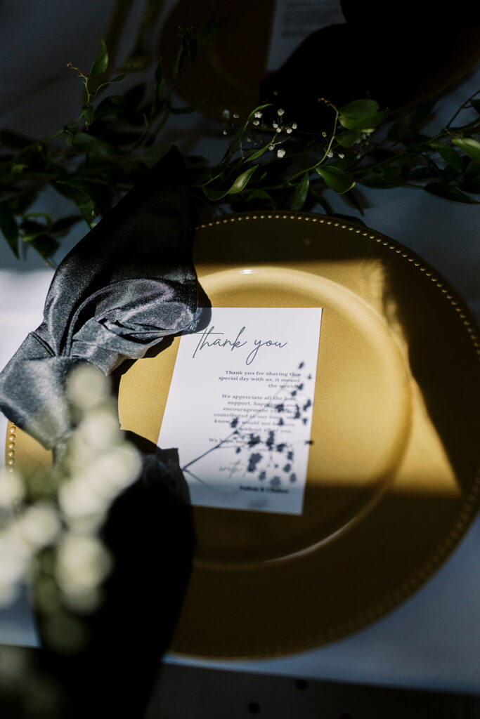 Detail photo of dinner place setting with mid day shadows