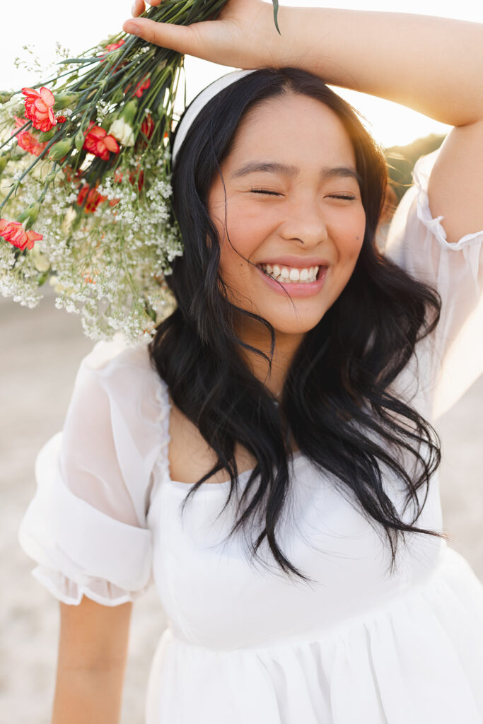 Unique A&M Senior session with a bouquet of flowers during golden hour