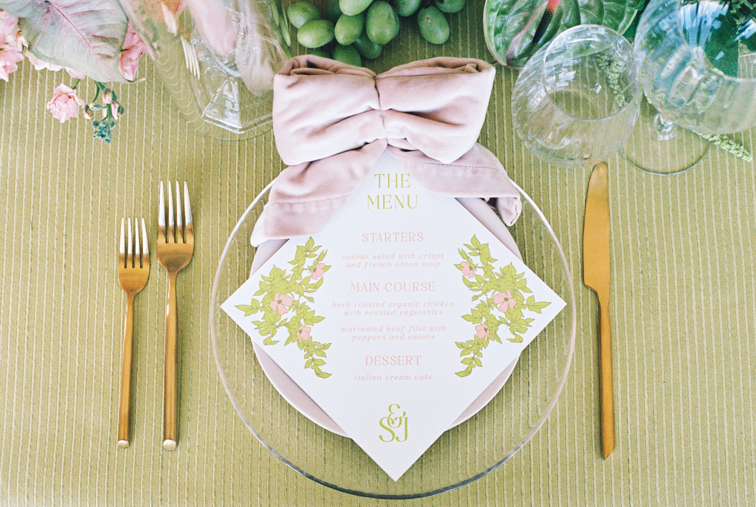 Wedding day green and pink place setting at The Emerson Venue in DFW