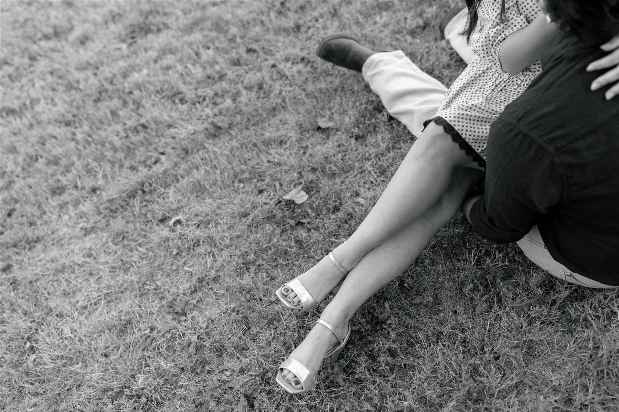 a couple's legs entangled during a downtown bryan engagement session