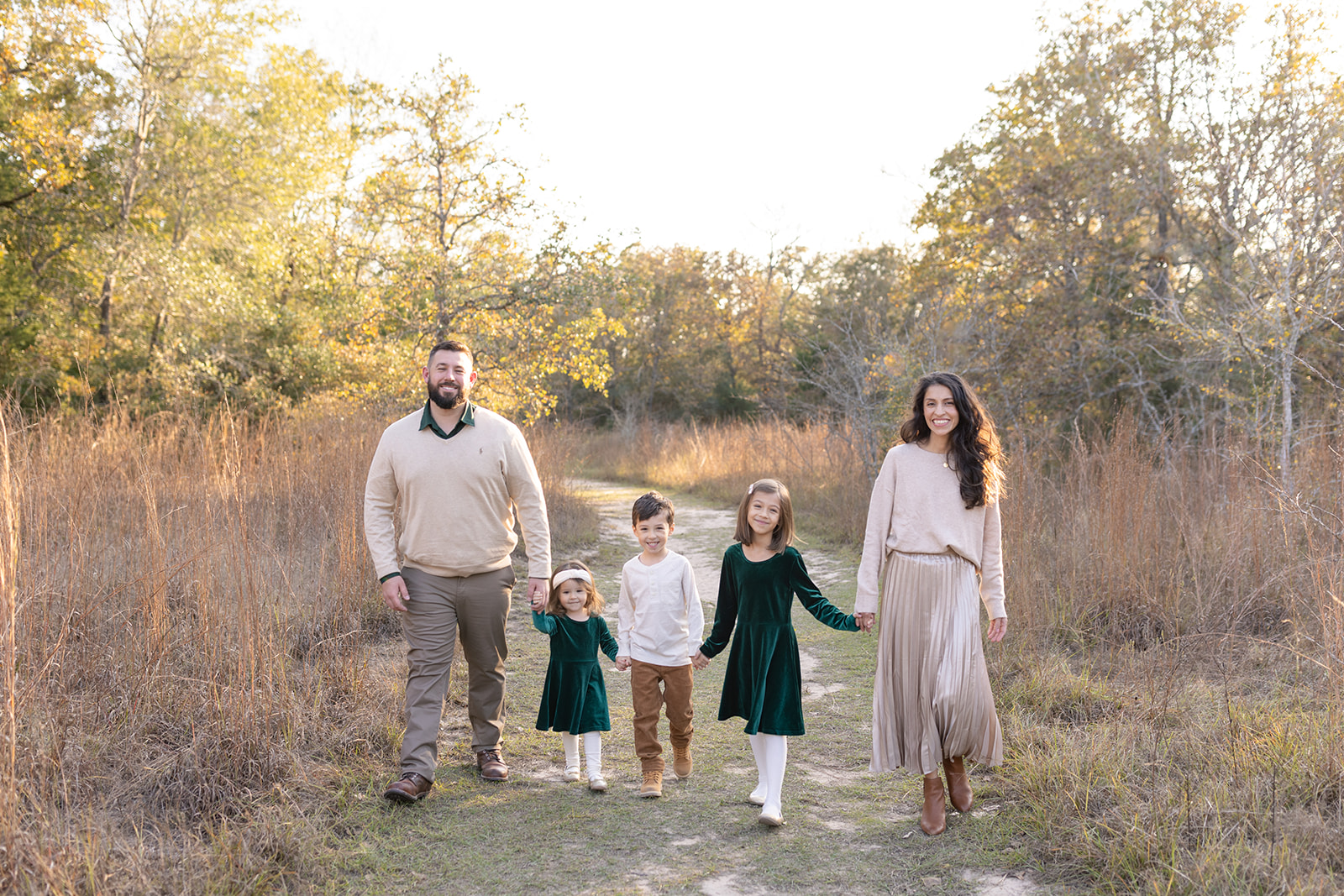 a family walking in a park in college station